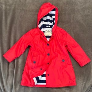 Red fabric lined kids raincoat